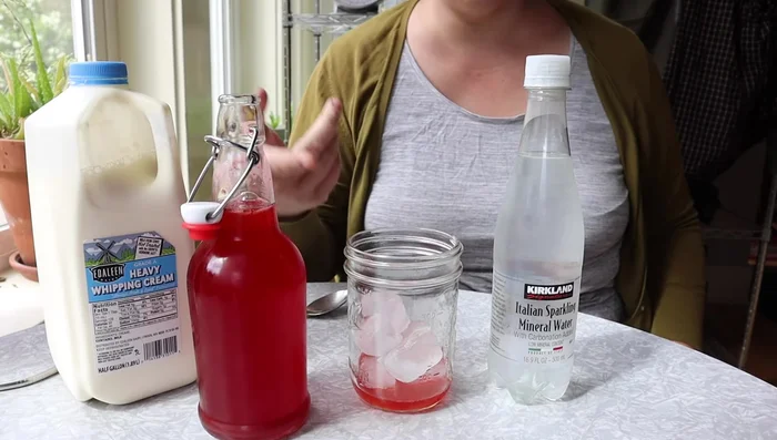 Once the syrup is ready and refrigerated, add some to a glass.
