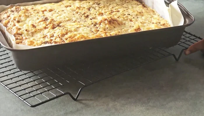 Bake for 20 minutes with both top and bottom elements on. Then, switch off the bottom element and bake for another 5 minutes using only top heat to get a golden crust.