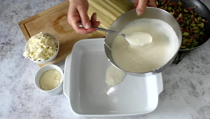 Repeat layers: Continue layering with béchamel, courgette mixture, mozzarella, and parmesan until you have at least 4 layers. Top with remaining courgettes and speck, mozzarella, and parmesan.