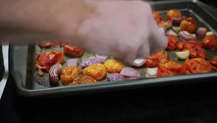 Remove the roasted garlic cloves from their skins.