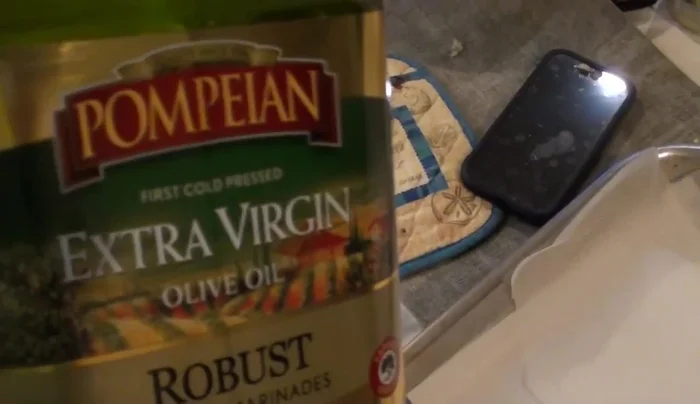 Lightly coat a baking sheet with olive oil or canola oil (437.28).