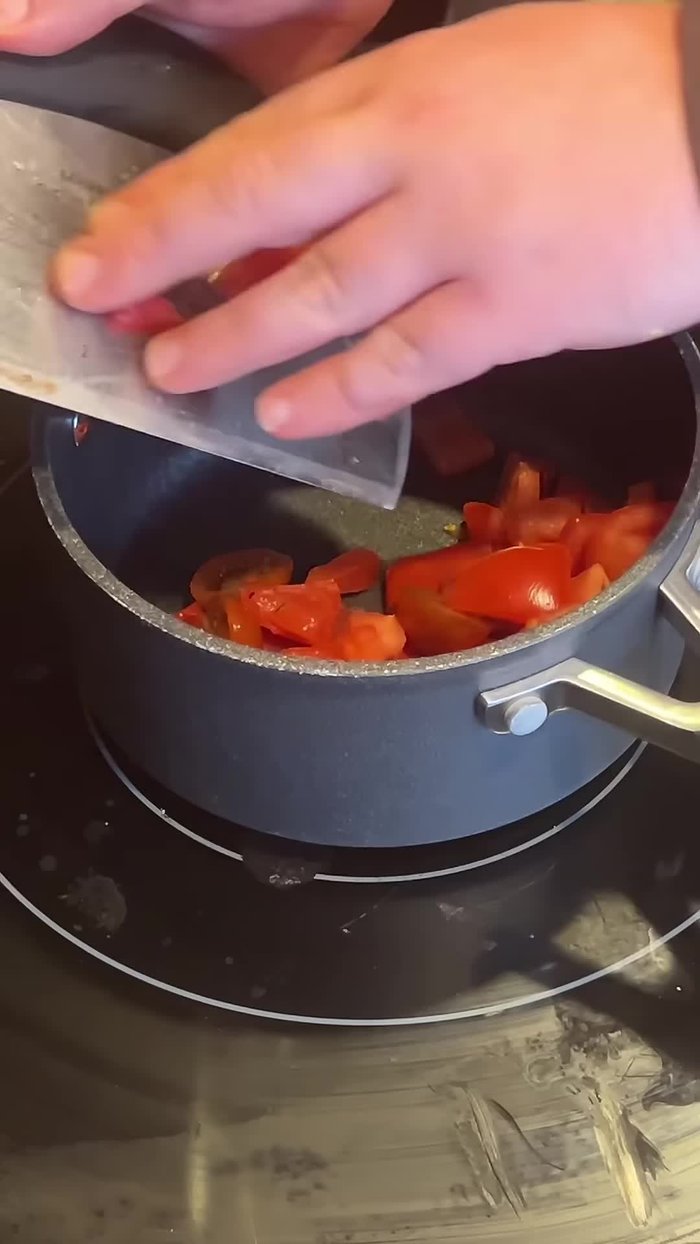 Make tomato jam: Combine tomatoes, red onion, brown sugar, lemon juice, garlic, basil, and salt. Bring to a boil, then reduce heat and simmer for about 30 minutes.