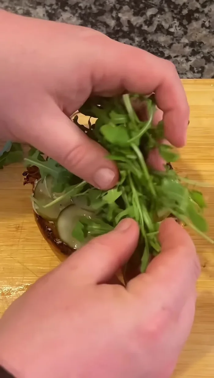 Assemble the burger: Spread sauce on the bottom bun. Add pickles, arugula, the cooked burger patty, crispy prosciutto, and tomato jam. Top with the other bun.