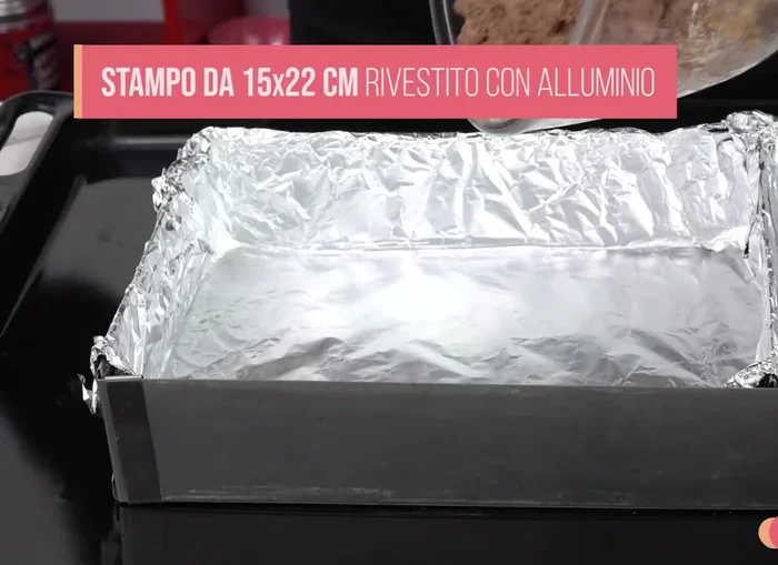 Line a rectangular mold with aluminum foil.