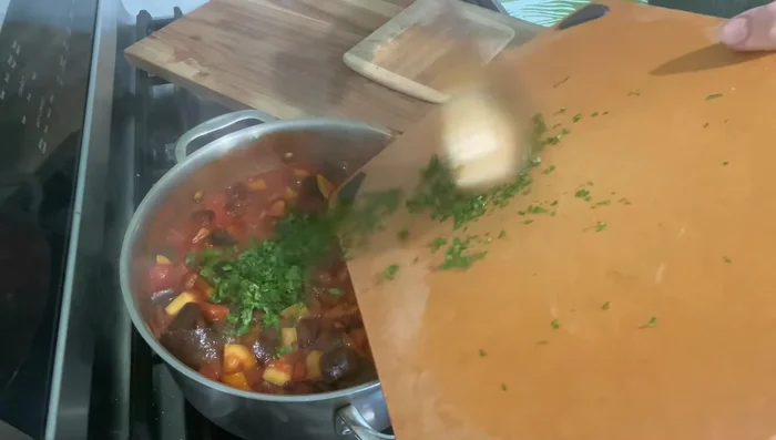Stir in chopped parsley (or other herbs).