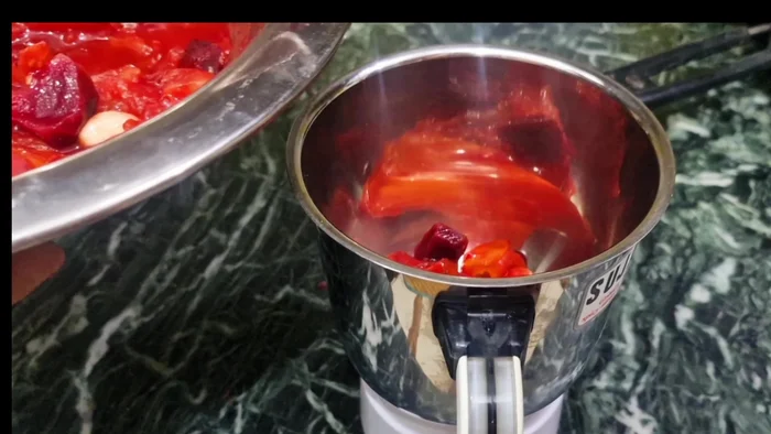 Once cooled, blend the tomatoes into a fine paste using a mixer.