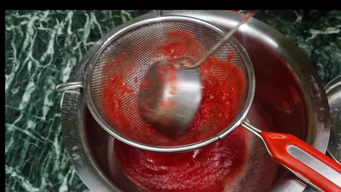 Strain the mixture through a sieve to remove seeds and peels.