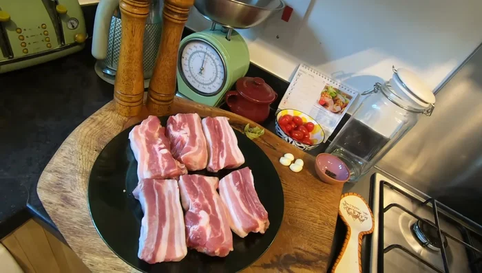 Ask your butcher for meaty pork ribs. In a pot, boil water with salt and pepper. Gently add the pork ribs, peppercorns, garlic, and bay leaves. Cover and let it simmer.