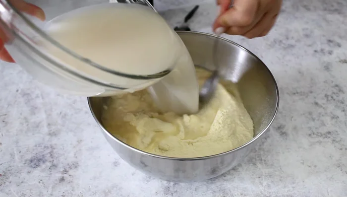 Mix in semolina flour, olive oil, and boiled potato. Knead until smooth.