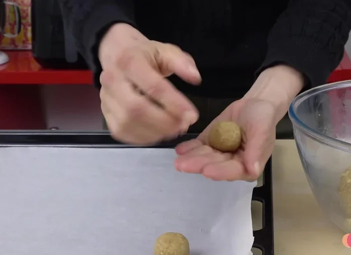 Roll out the dough with a rolling pin and use cookie cutters, or flatten dough balls with your fingers or a glass.