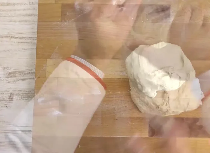 Shape the dough into a focaccia and place it on a baking sheet.
