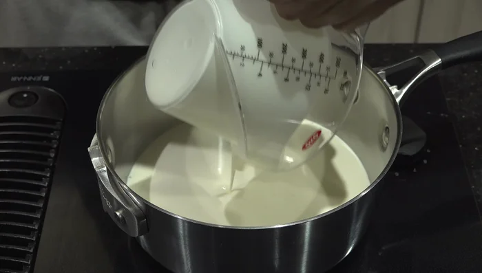 Add 1 1/2 cups of heavy whipping cream to the melted butter. (66.159)