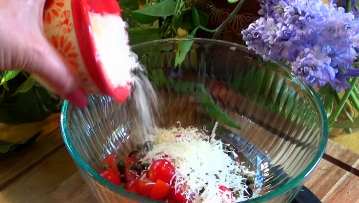 Combine all ingredients: In a large bowl, combine the cooled rice, olives, tomatoes, capers, Parmesan cheese, parsley (if using), garlic powder, and a generous drizzle of olive oil. Mix well.