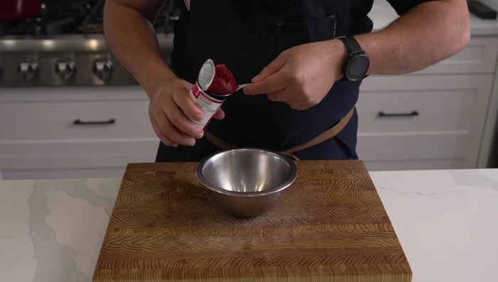 Prepare the ragu: Finely dice 1 onion, 2 celery sticks, and 1 carrot. Crush 3 garlic cloves with 2 bay leaves.