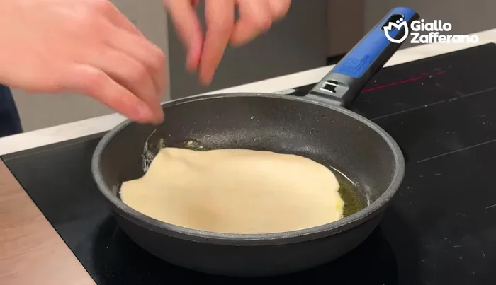 Gently place each rolled-out dough into the pan. Cover with a lid (leaving a small vent) and cook for 3-4 minutes per side.