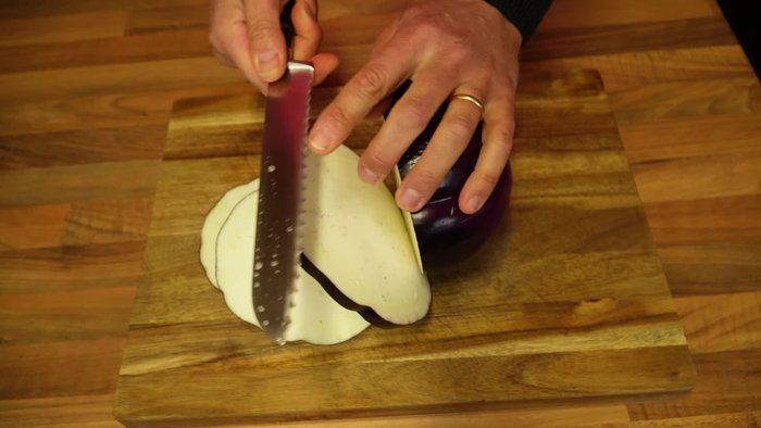 Slice the eggplants into 1cm thick slices using a bread knife.