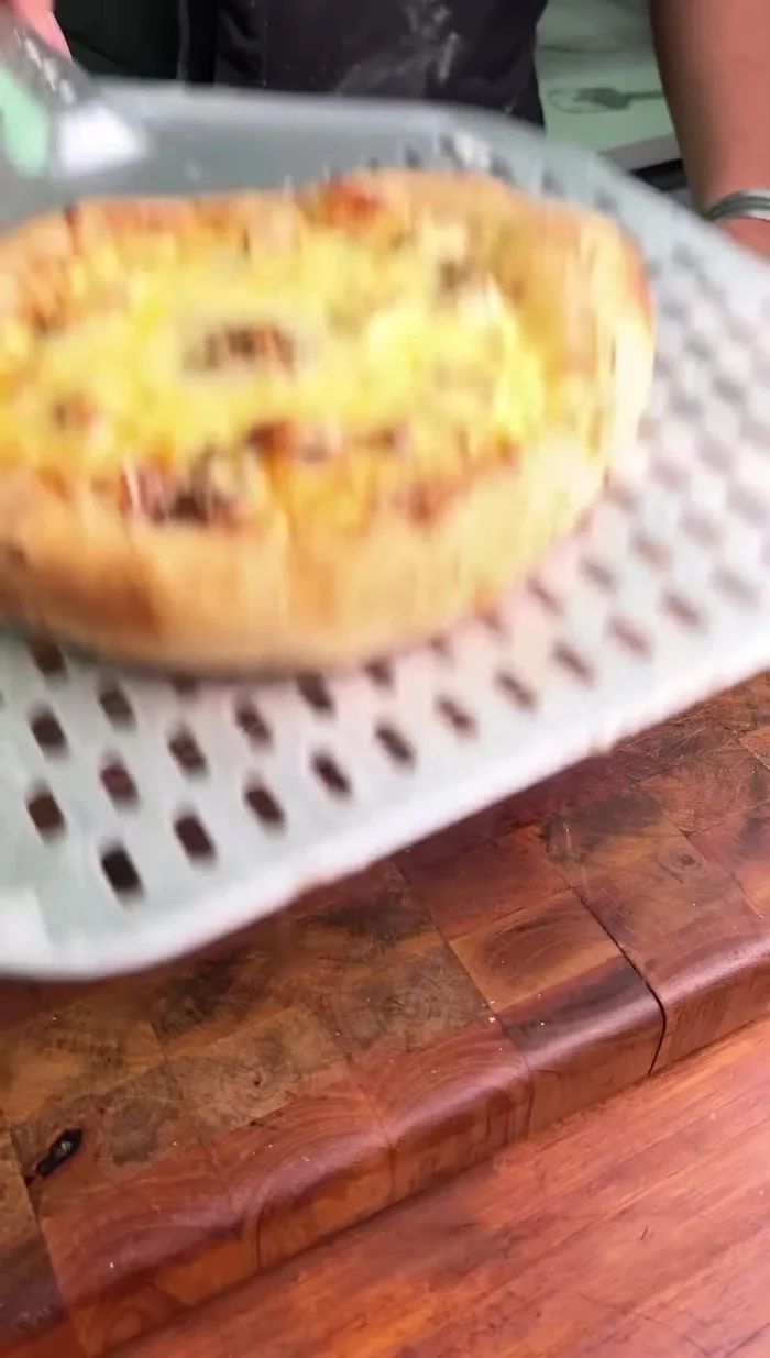 Bake the pizza until golden brown.