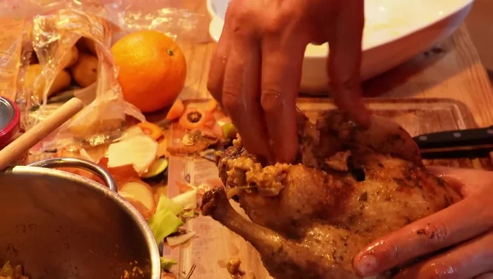 Stuff the duck: Fill the duck cavity with the sausage and breadcrumb mixture. Secure with string.