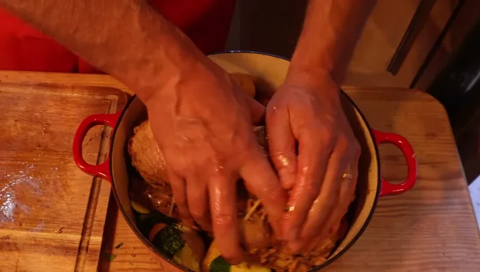 Arrange vegetables: Arrange prepared vegetables around the duck in the cast iron pot, add white wine.