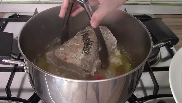 After an hour, remove the roast and set aside. Remove any remaining solids from the cooking base.