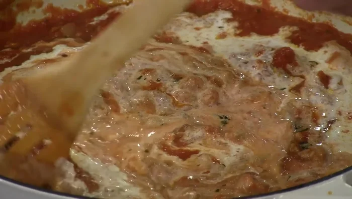 Reduce heat on sauce and stir in heavy cream and Parmesan cheese until creamy.
