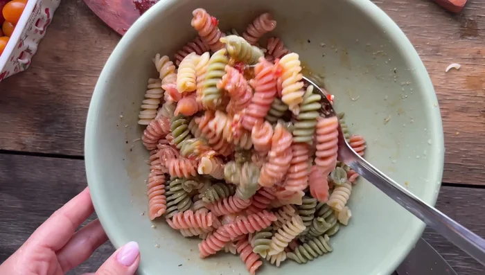 Add the cooked pasta to the dressing and toss to combine.