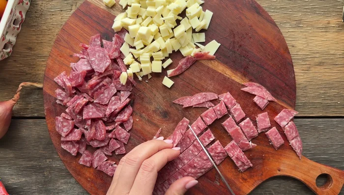 Chop up your desired cured meats (privalone, soppressata, salami, etc.) from the refrigerator.