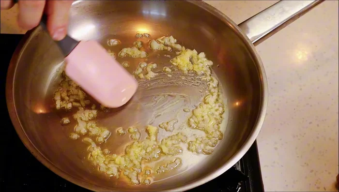 Add 1 small clove of minced garlic. Don't let it burn.