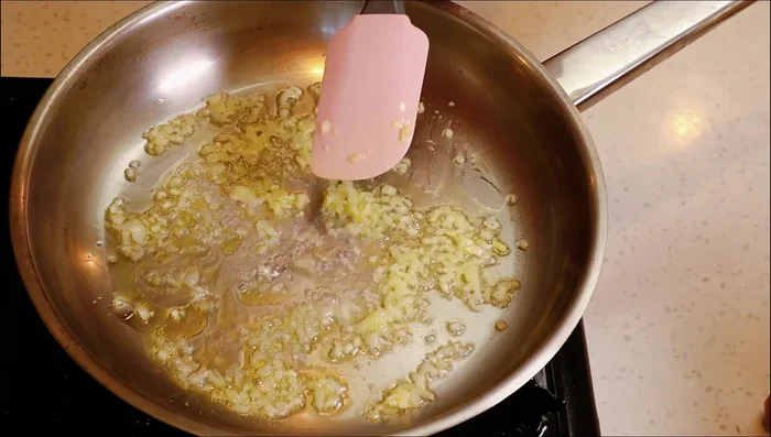 Add a little water to prevent the onion and garlic from cooking too fast.