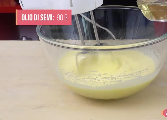Add 90ml of seed oil and the grated lemon zest.