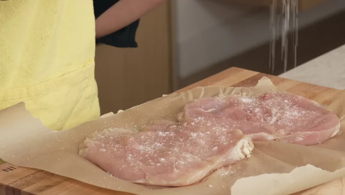 Season chicken with salt and pepper.