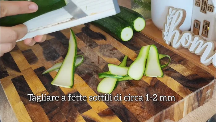 Season the zucchini: Drizzle olive oil over the zucchini slices. Season generously with salt and pepper. Add minced garlic and/or herbs if desired.