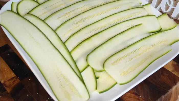 Grill the zucchini: Preheat your grill to medium-high heat. Place the zucchini slices on the grill and cook for 2-3 minutes per side, or until tender and slightly charred. If using a grill pan, follow the same instructions.