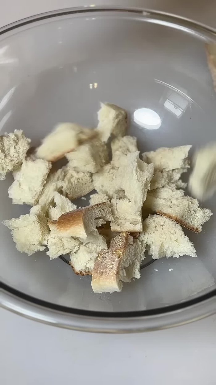 Cut up the leftover Italian bread and rip it into small, relatively even-sized pieces.