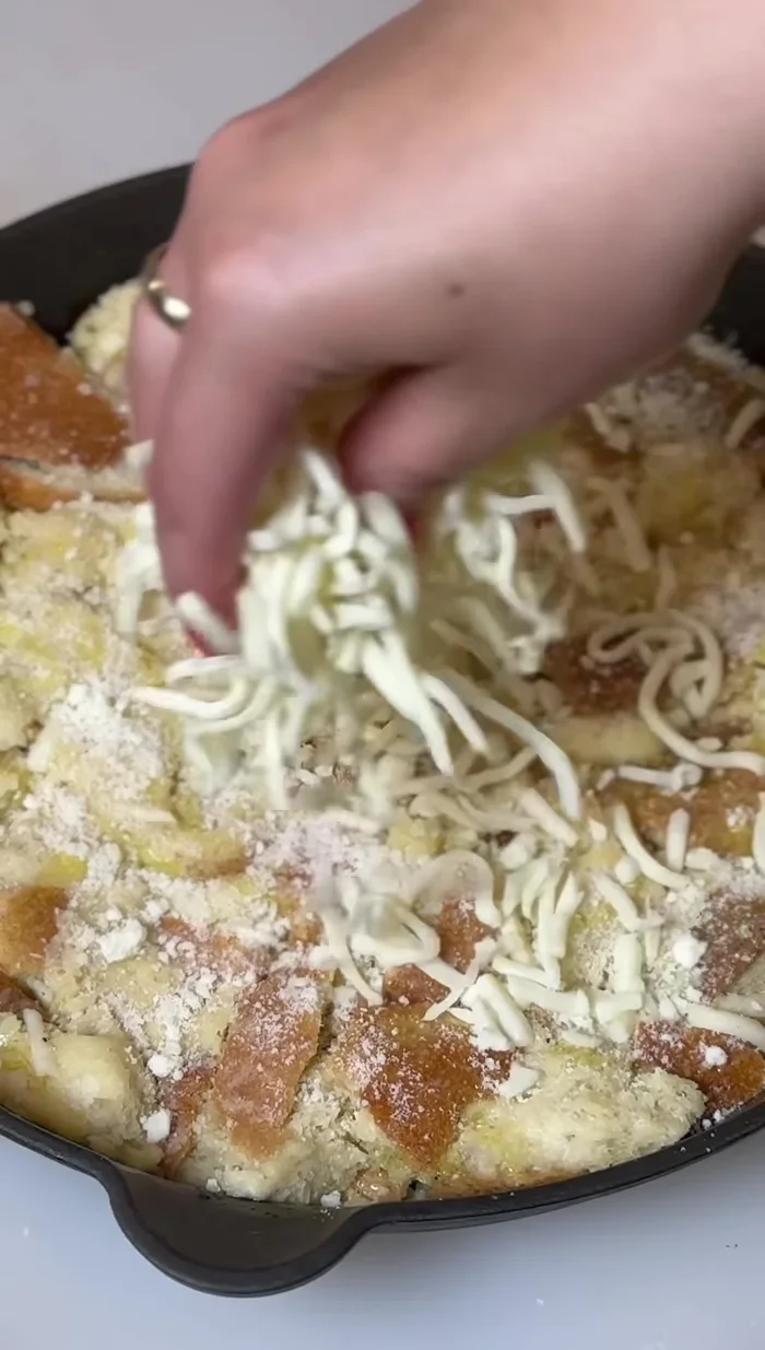 Drizzle with a bit more olive oil, sprinkle with extra Pecorino Romano and mozzarella cheese.