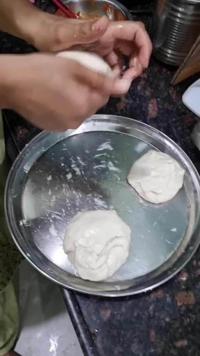 Separate the dough into pieces for the desired number of pizzas.