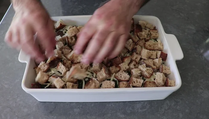 Repeat layers: bread cubes, remaining sausage, remaining spinach, and remaining cheese. Pour egg mixture over the top.