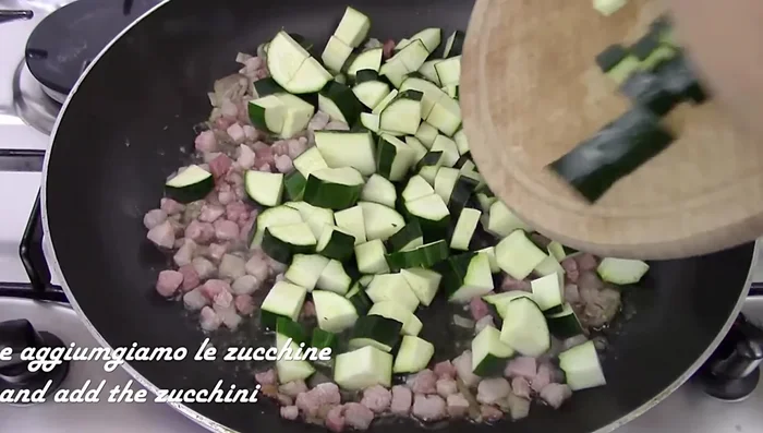 Add courgettes to the pan. Cook over high heat for 10-15 minutes without adding water, until golden brown.