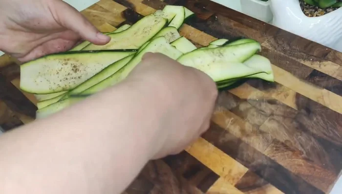 Arrange zucchini on a baking sheet.