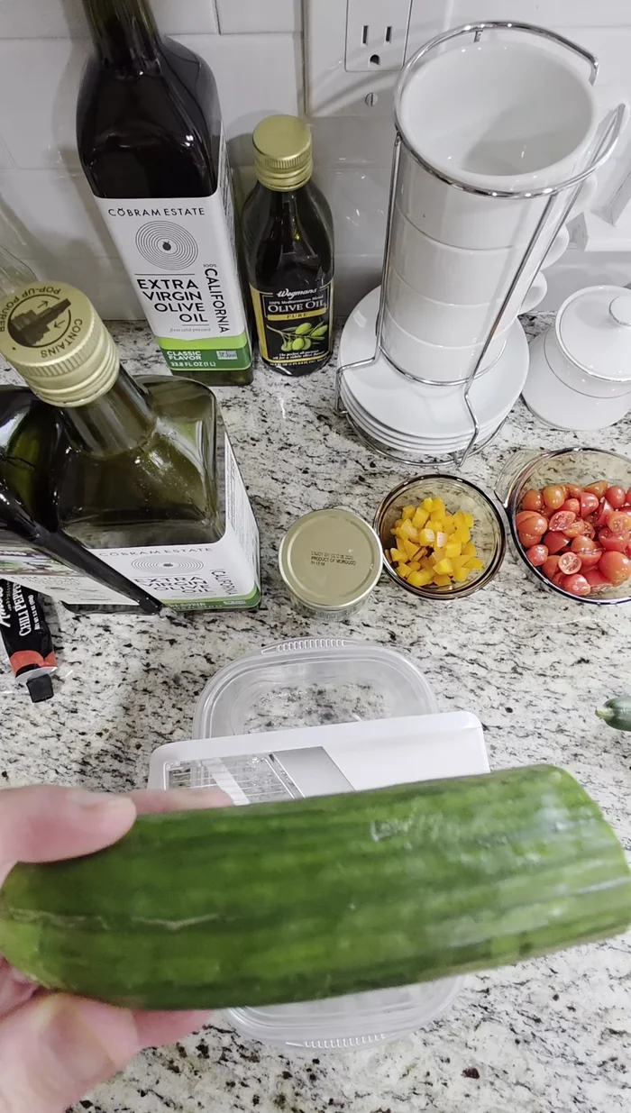 Prepare the cucumber: Cut the cucumber in half. Using a mandolin slicer on the thickest setting, slice the cucumber into relatively thick pieces. Be careful!