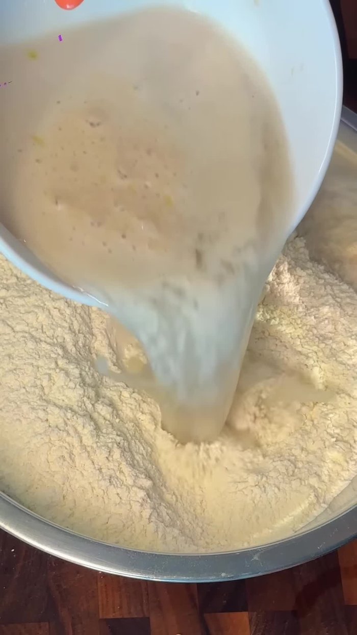 In a mixing bowl, combine semolina and double zero flour, salt, and bloom cheese. Mix into a shaggy dough, then knead until smooth and elastic.