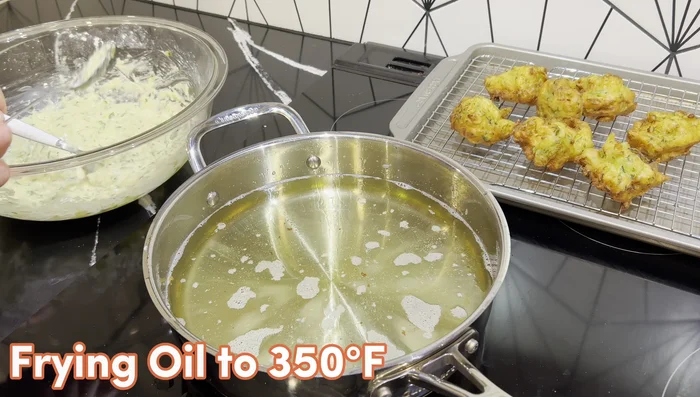 Heat about 1.5 inches of frying oil to 350°F in a frying pan. Using a spoon, scoop about a tablespoon of batter, shape it, and carefully drop into the hot oil (8-10 at a time). Nudge them apart with a fork.