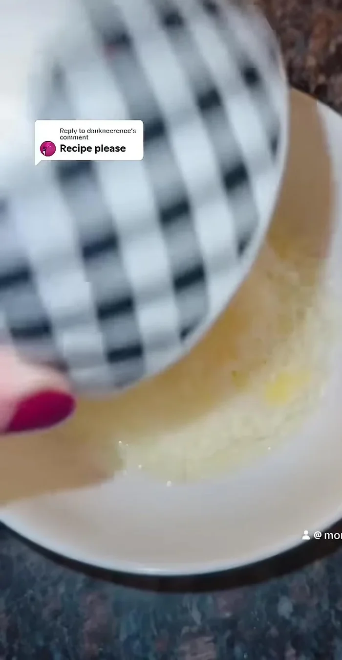 In a bowl, whisk together one egg and parmesan cheese.