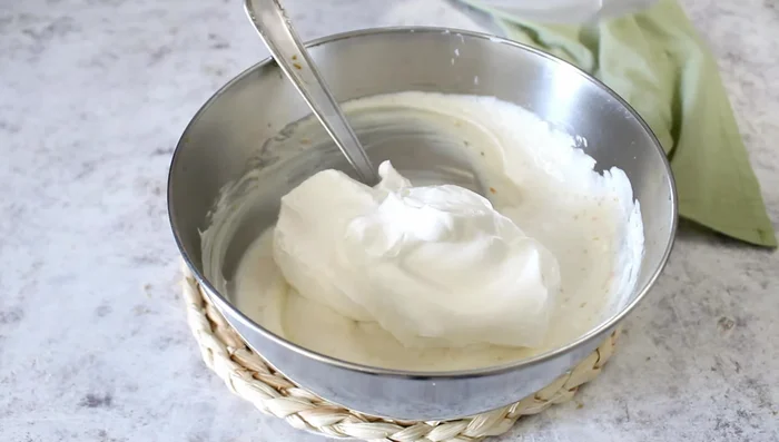 Gently fold the whipped cream into the ricotta mixture.