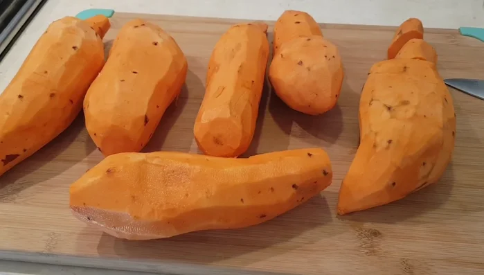 Boil the sweet potatoes in a large pot of water until a fork can easily pierce them.