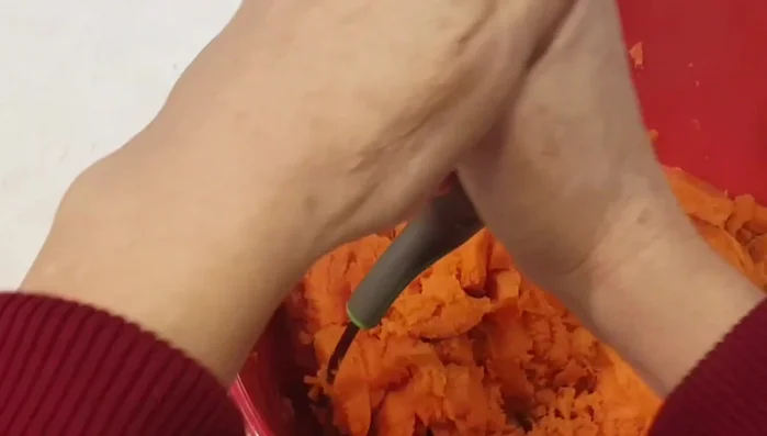 Mash the boiled sweet potatoes.
