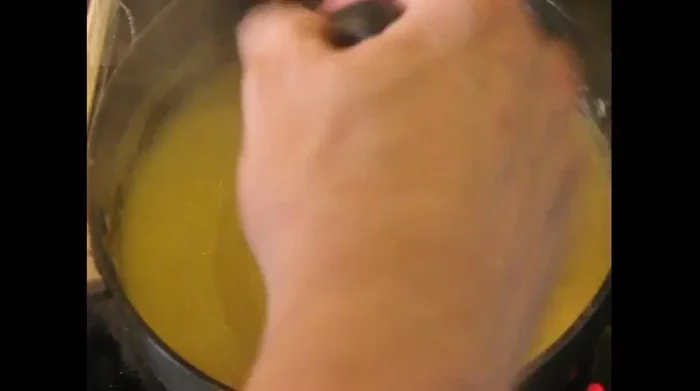 Reduce heat to two on a scale of 1 to 10. Stir continuously, scraping the bottom of the pan to prevent sticking.