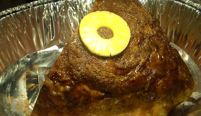 Insert toothpicks into the pineapples and place them into the scored ham.