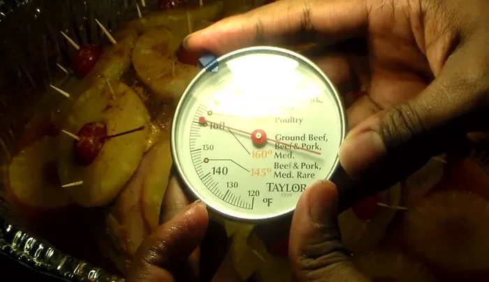 Bake the ham until a meat thermometer inserted into the thickest part registers 160°F (71°C).