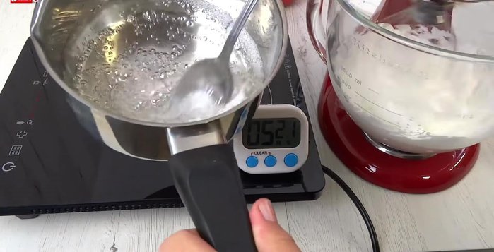 Once the syrup reaches 118°C (244°F), add 1/2 tsp lemon flavored fruit salt (or lemon juice to egg whites).
